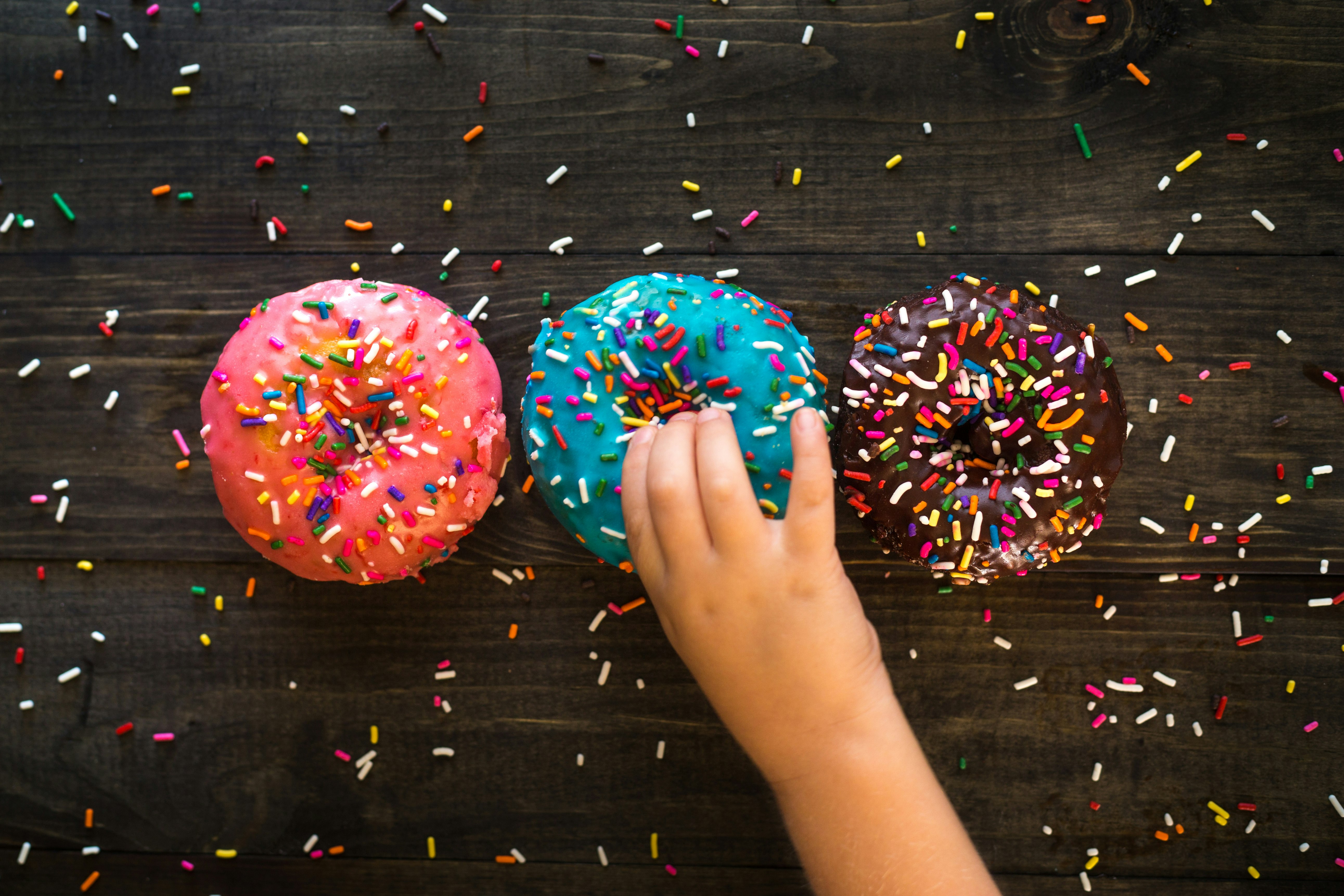 three sprinkled doughnuts